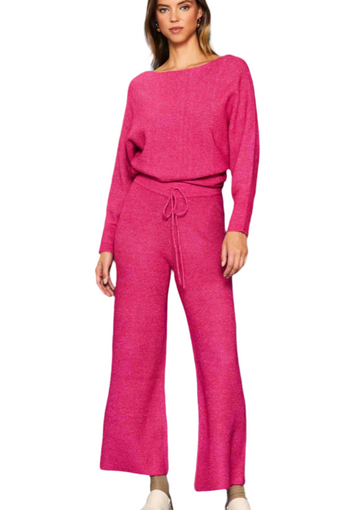 Woman wearing a pink outfit on a white background