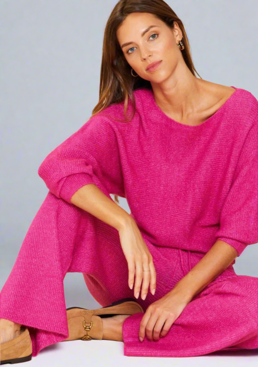 Woman wearing a pink outfit on a white background