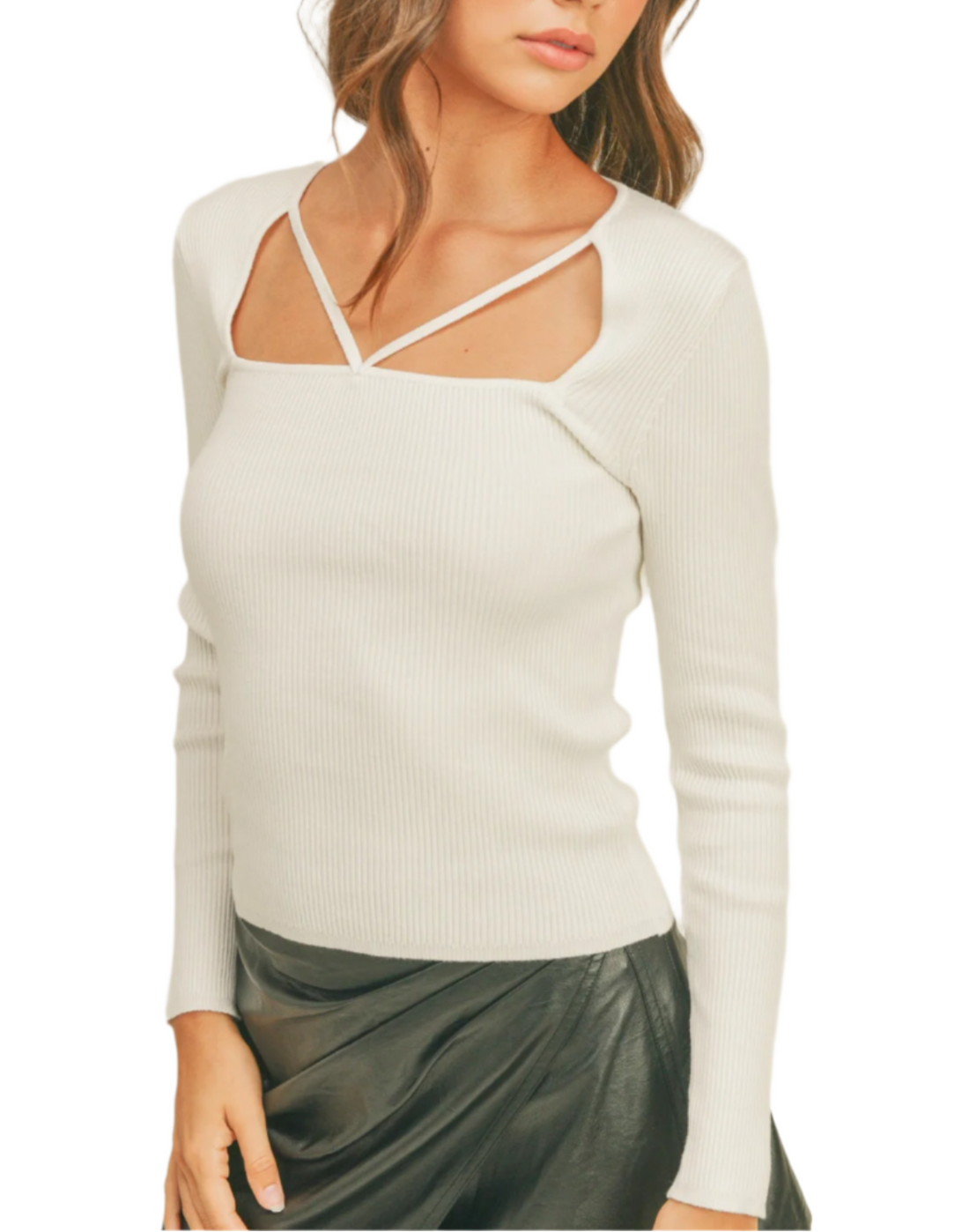 Woman wearing a white long-sleeve top and black skirt with a black cap on a white background