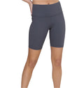 A pair of high-waisted gray biker shorts on a female model, designed for physical activity with a high waistband.