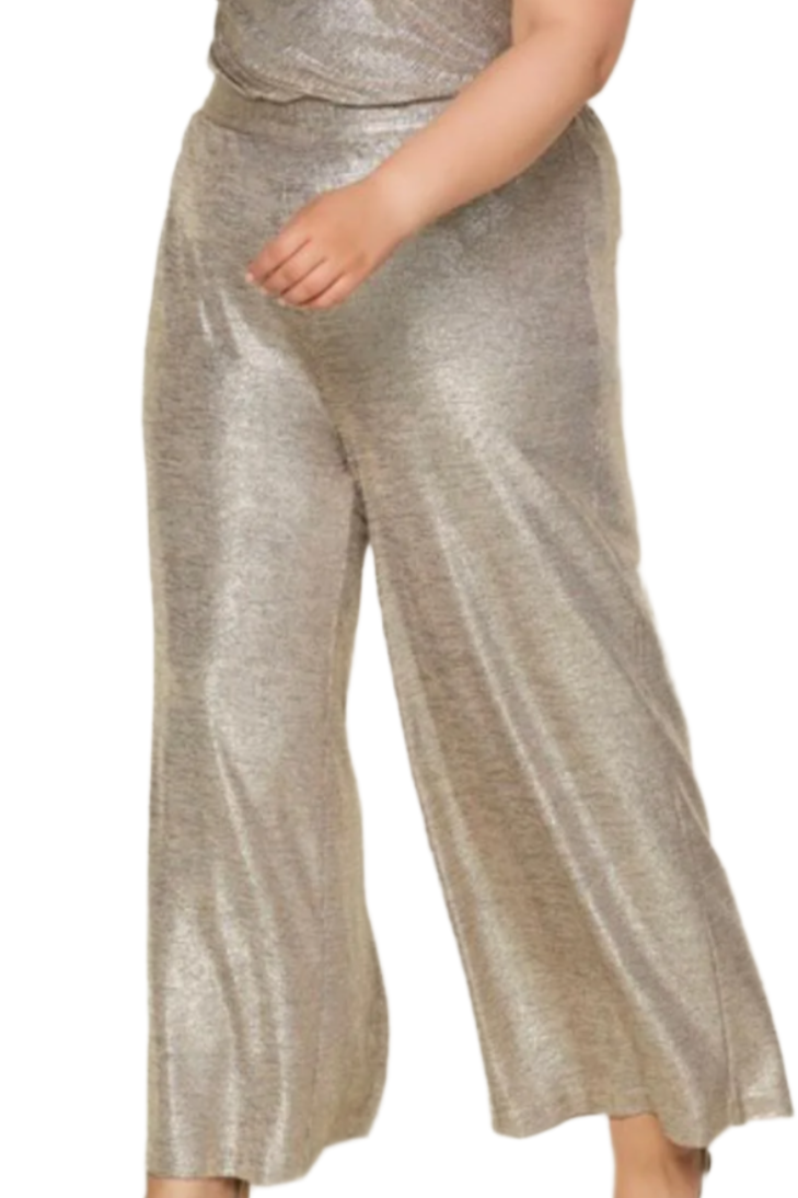 Woman wearing a metallic silver jumpsuit on a white background