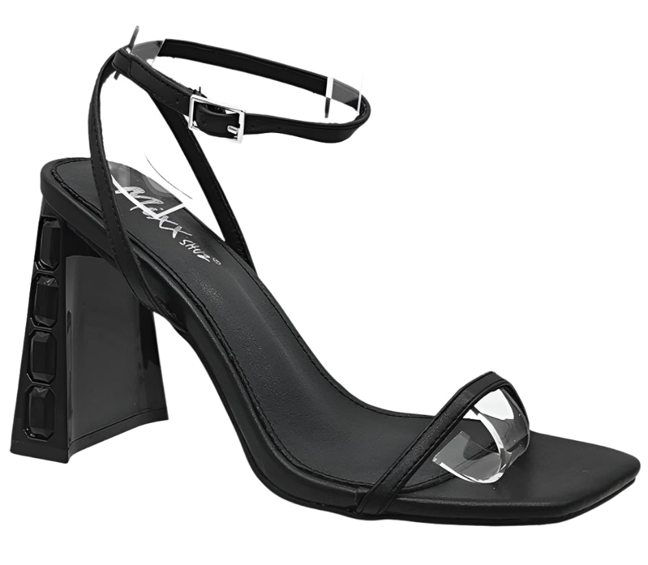 A black sandal with a block heel and tubular straps, featuring a square toe and a metallic buckle.