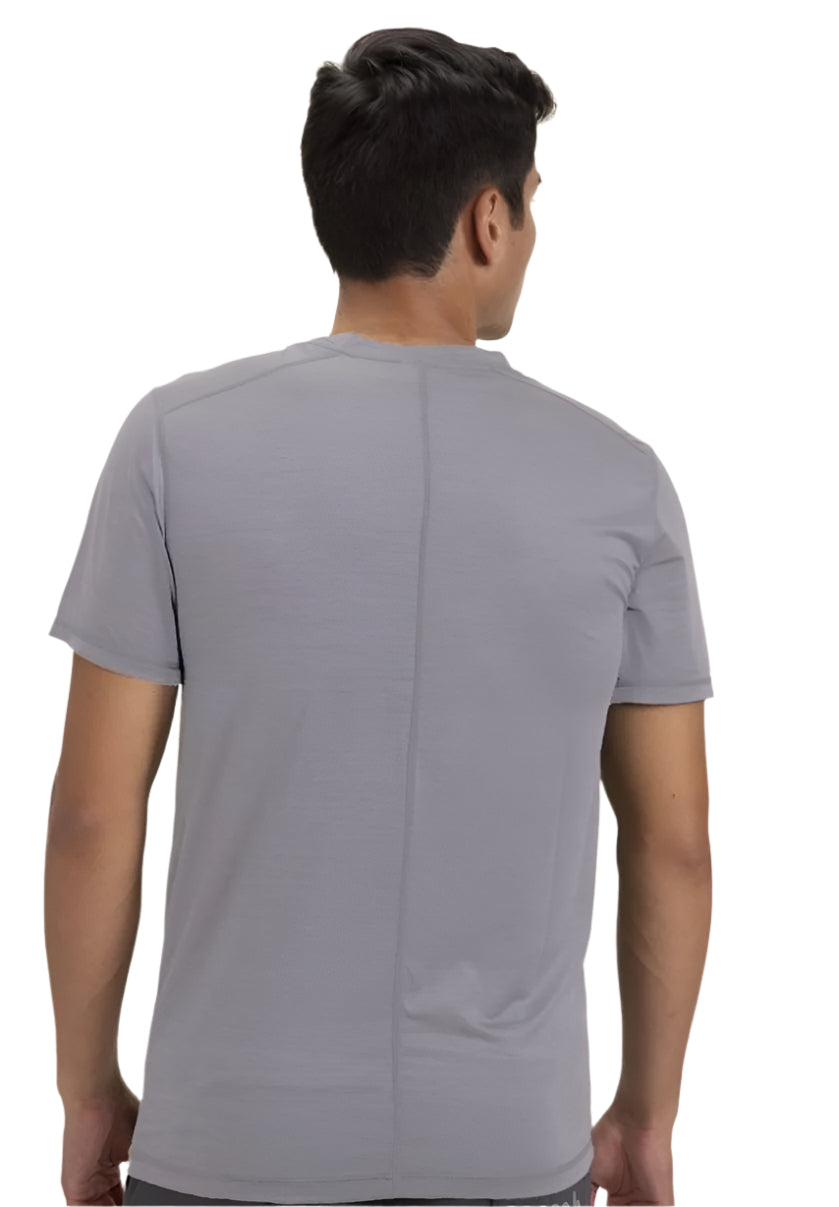 Man wearing a gray t-shirt on a white background