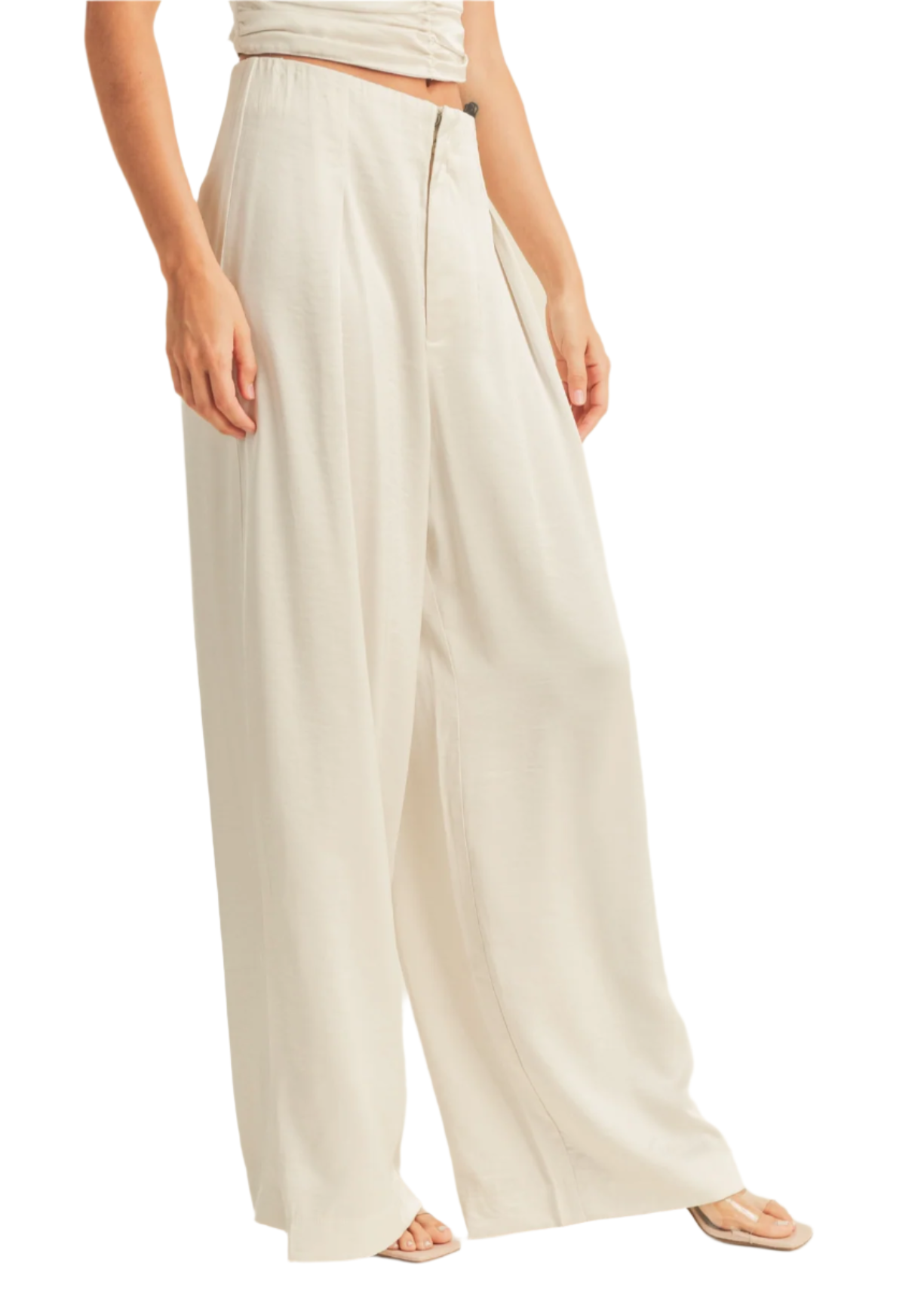 Beige wide-leg pants worn by a person on a white background