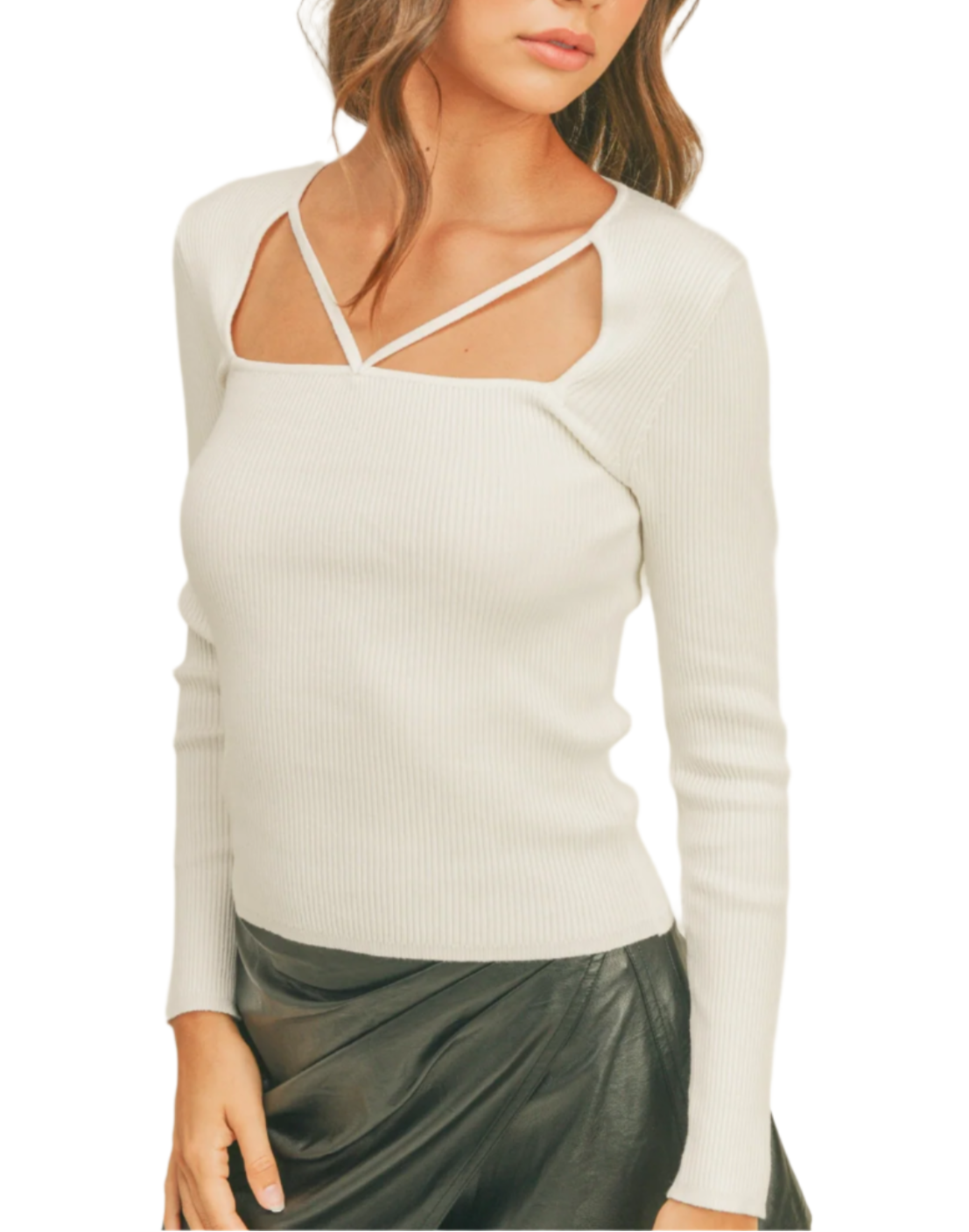 Woman wearing a white long-sleeve top and black skirt with a black cap on a white background
