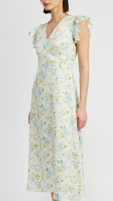 Woman wearing a floral dress on a white background