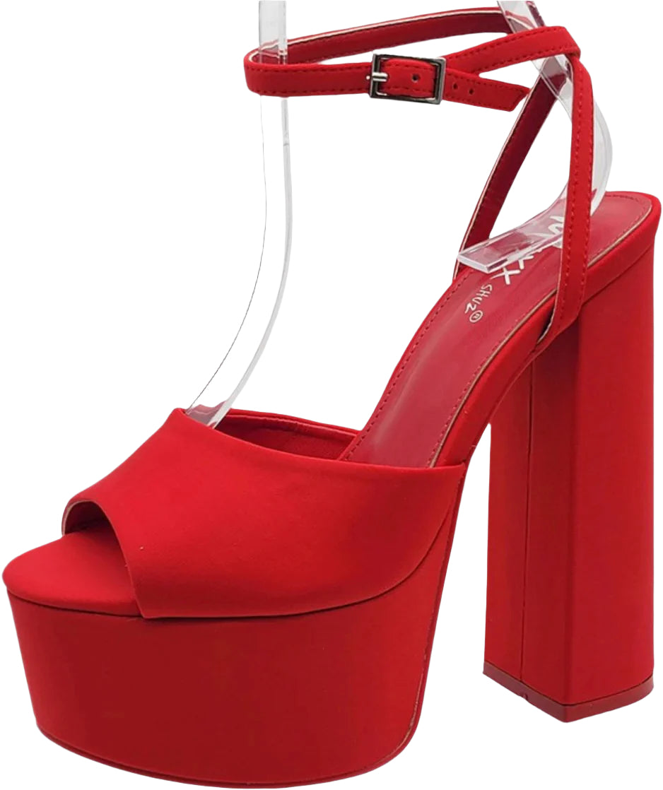 A red, open-toe platform heel with a block sole and a small ankle strap with a buckle.